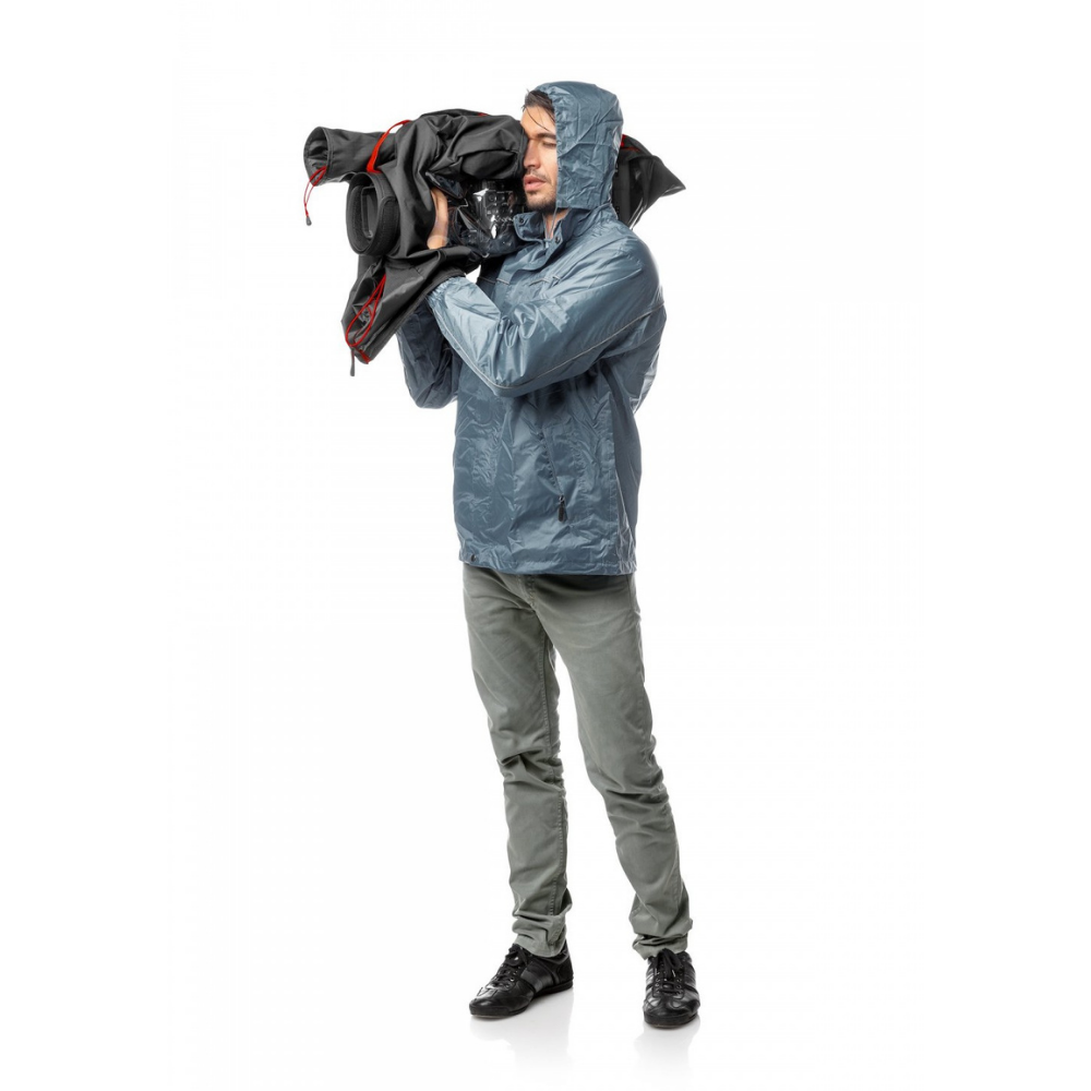 Camera operator using a large camcorder with the Manfrotto RC-1 rain cover