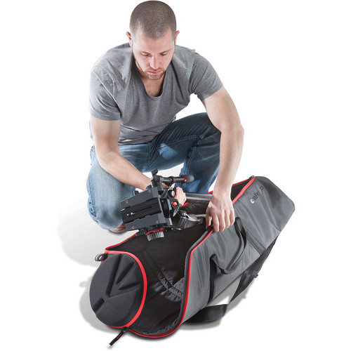 Loading a tripod with head into the open Manfrotto MBAG100PNHD bag