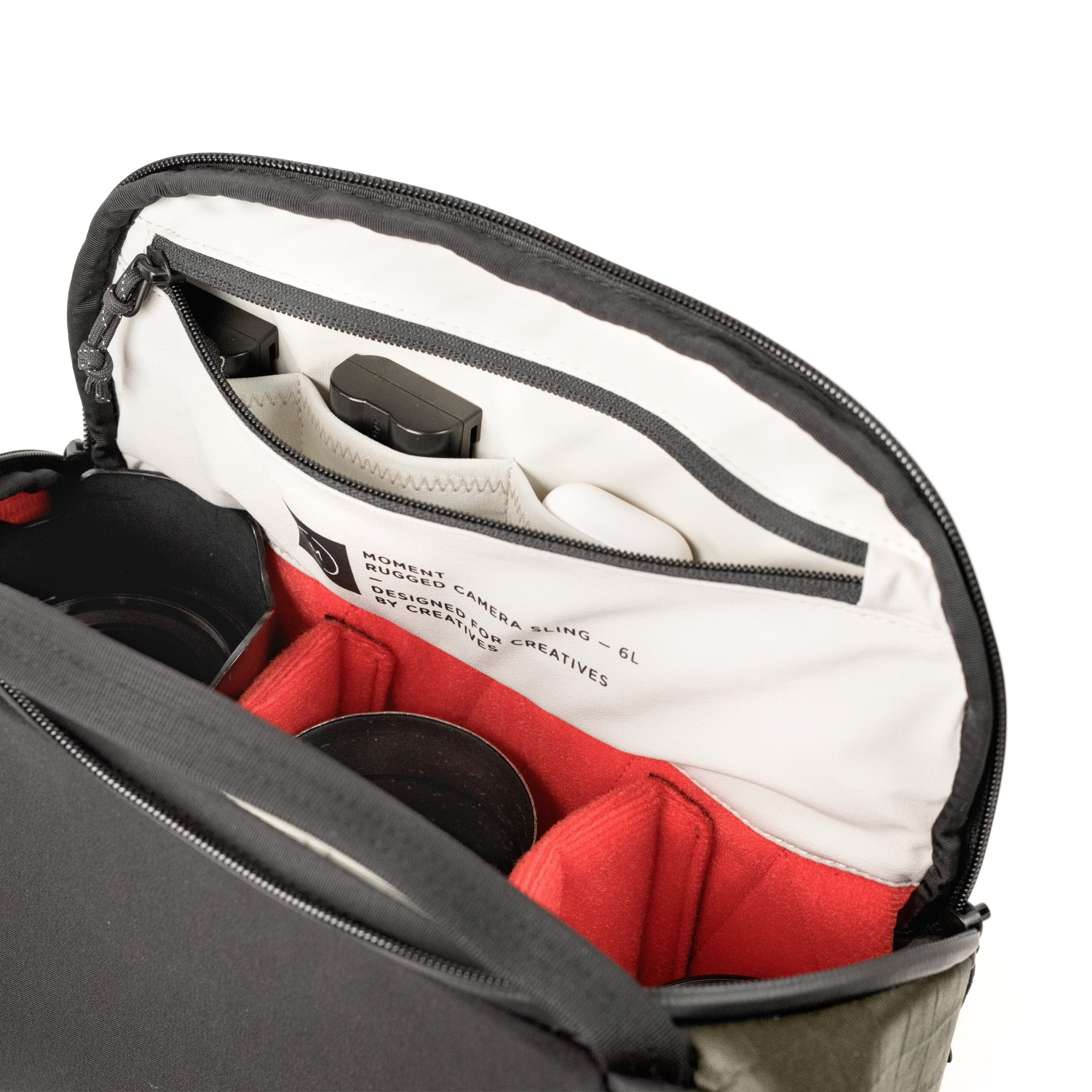 Pockets and bright interior of the Moment Rugged 6L sling