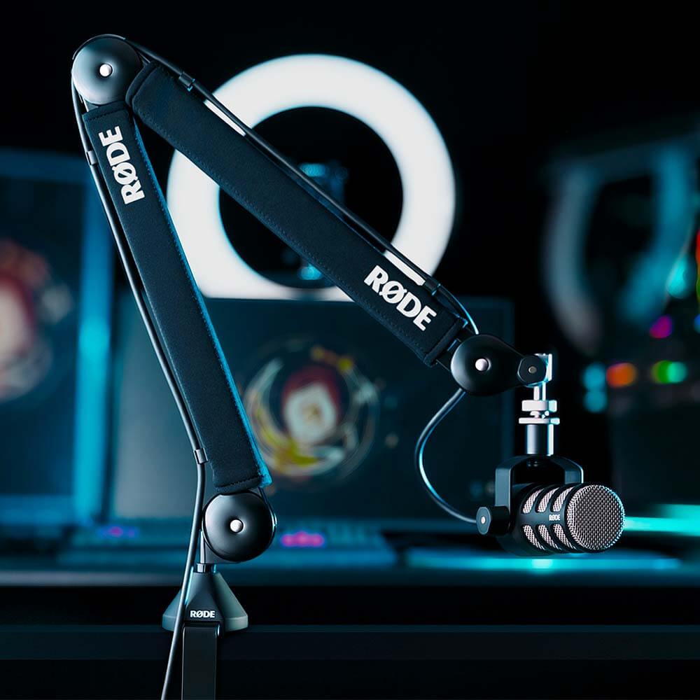 Black RØDE PSA1+ arm with a PodMic at a gaming and streaming setup