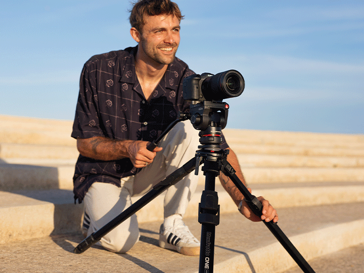 Creator operating the Manfrotto ONE aluminium tripod and 500X head