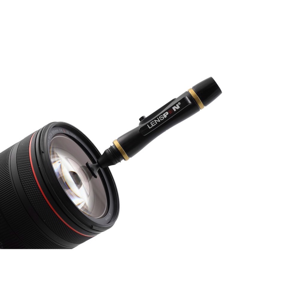 The kit's Original LensPen cleaning a camera lens
