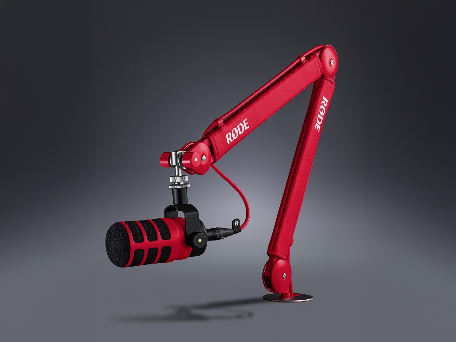 Red RØDE PSA1+ studio arm with a microphone