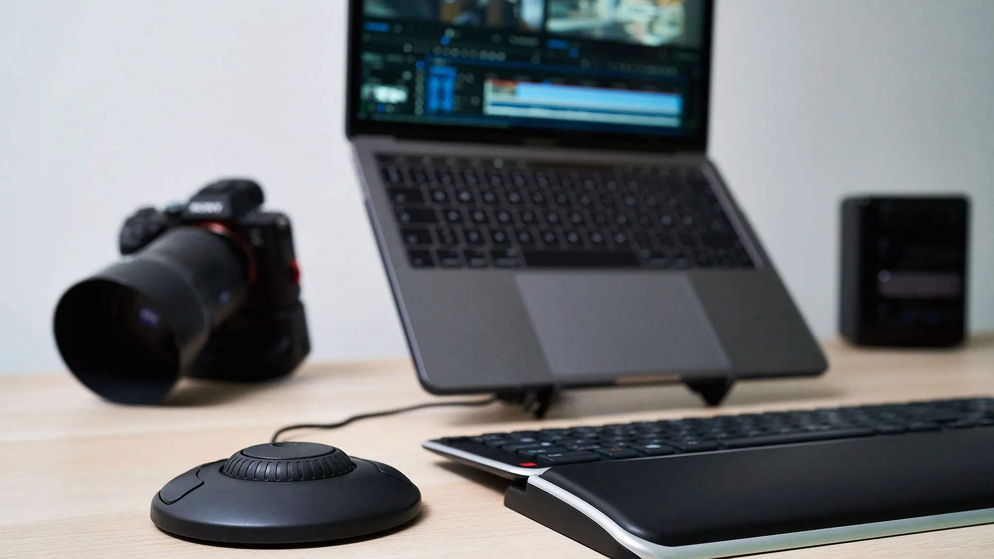 Compact ShuttleXpress beside a laptop