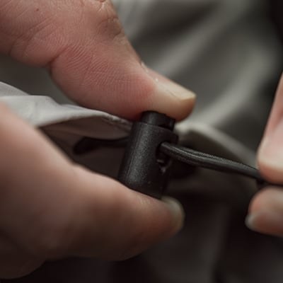 Drawstrings at cuffs and hem