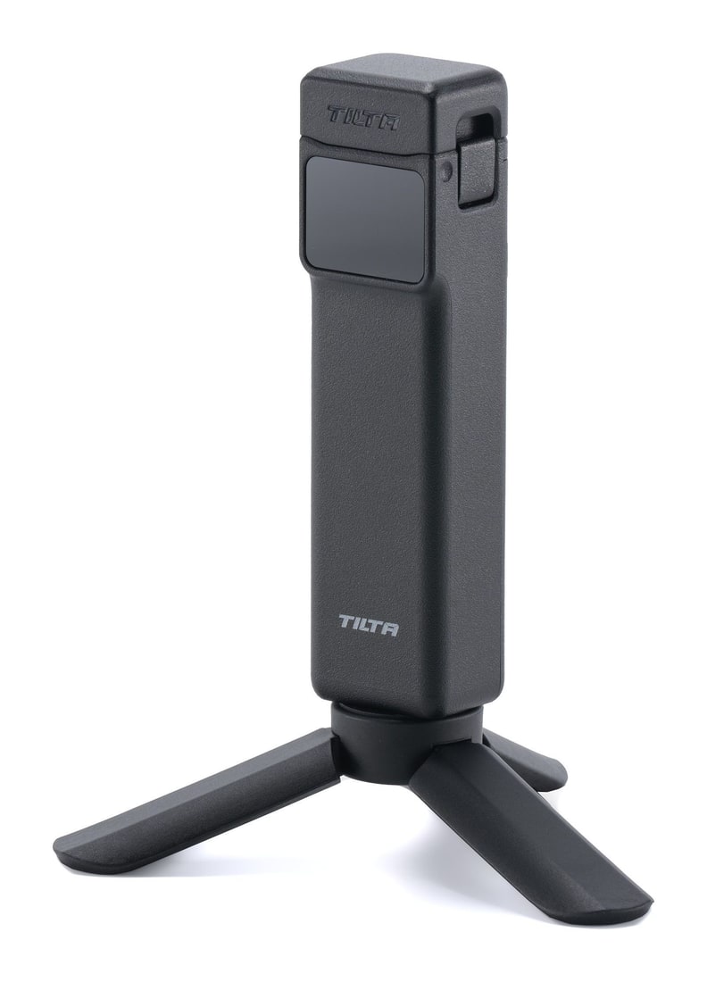 A mini tripod and a port cap in the box