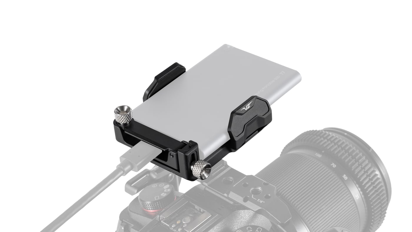 Two 1/4″-20 screws in a sliding slot