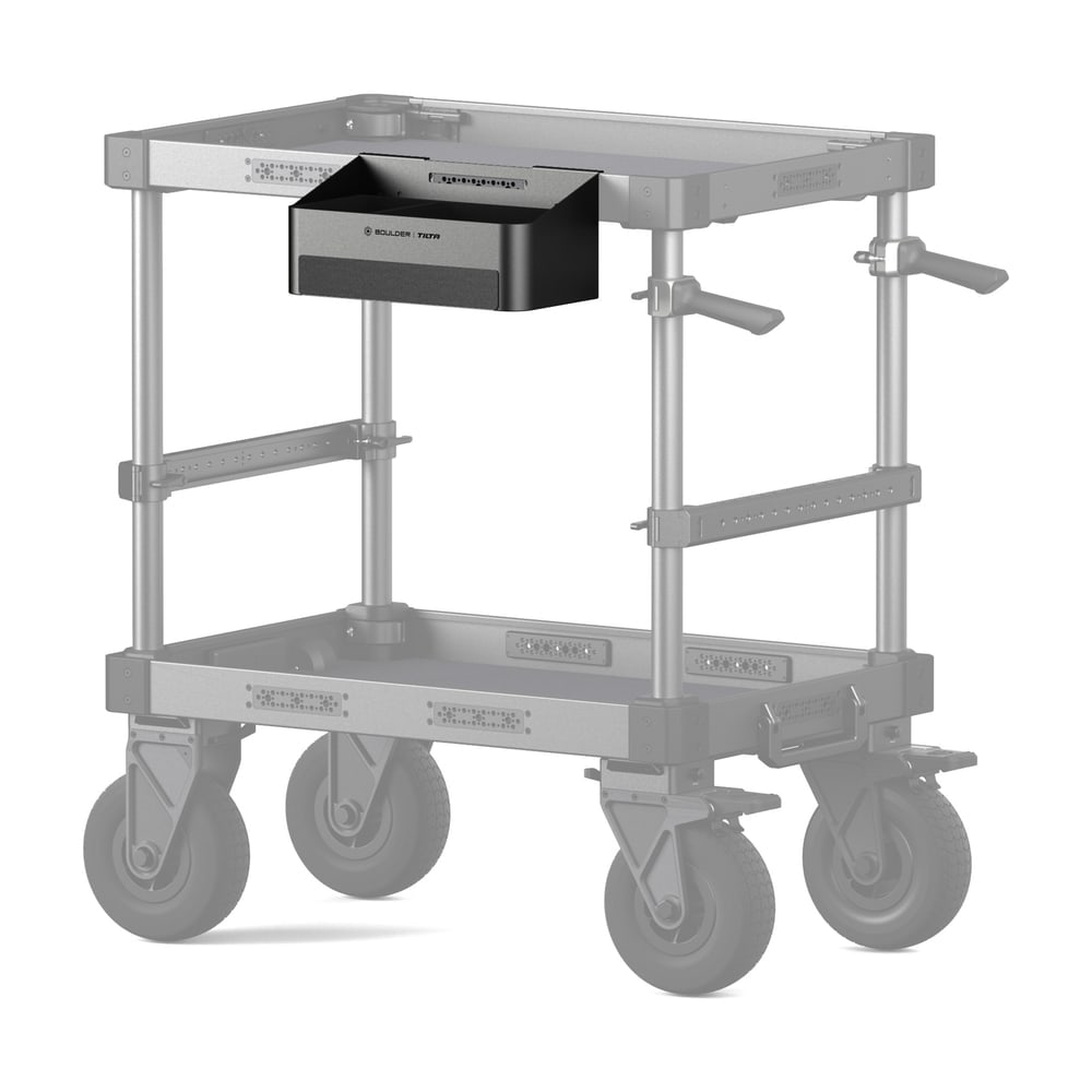 Hung from the side beneath the tray