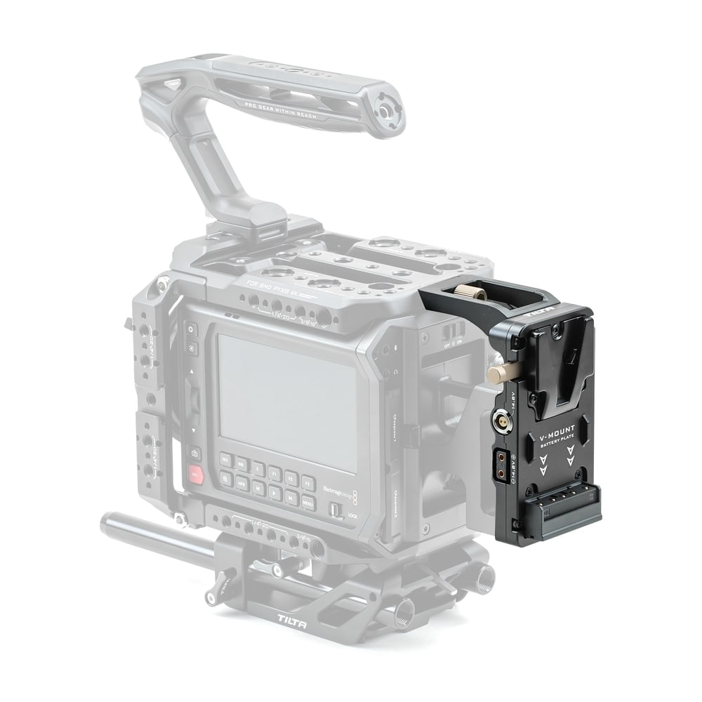 In the battery compartment, secured by the top plate